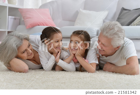 Happy senior couple with grandchildren Happy senior couple with grandchildren 21581342