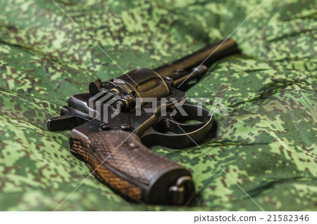 vintage pistol on pixel camouflage background 21582346