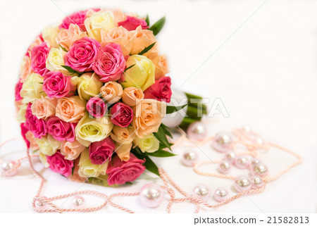 A wedding round bouquet with pink and yellow roses 21582813