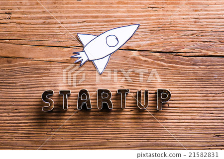 Office desk with start up sign and paper rocket. - Stock Illustration ...