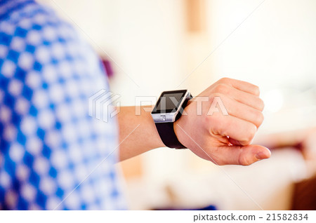 Close up of unrecognizable man using smart watch Close up of unrecognizable man using smart watch 21582834