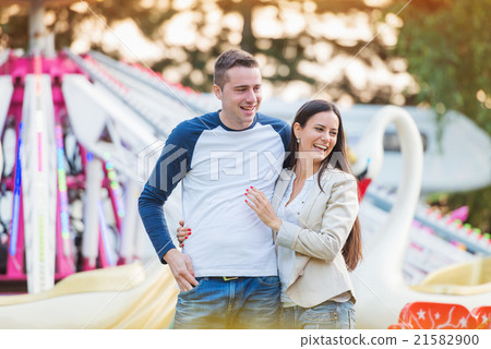 Parents at fun fair, looking at their child taking Parents at fun fair, looking at their child taking 21582900