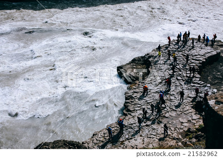 Gullfoss waterfall with people on rocks in Iceland Gullfoss waterfall with people on rocks in Iceland 21582962
