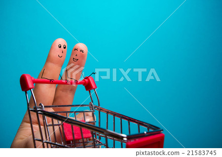 Funny fingers shopping at supermarket with red Funny fingers shopping at supermarket with red 21583745