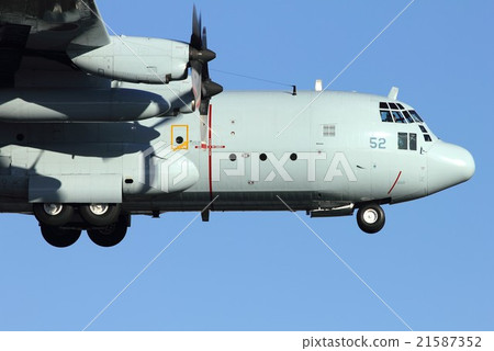 Maritime Self-Defense Force C-130 Hercules Transportation Machine flying against the blue sky 21587352