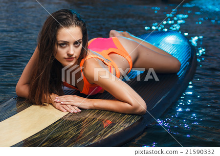 Fashion portrait: beautiful girl with surf board Fashion portrait: beautiful girl with surf board 21590332