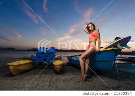 Fashion portrait: beautiful girl with surf board Fashion portrait: beautiful girl with surf board 21590334