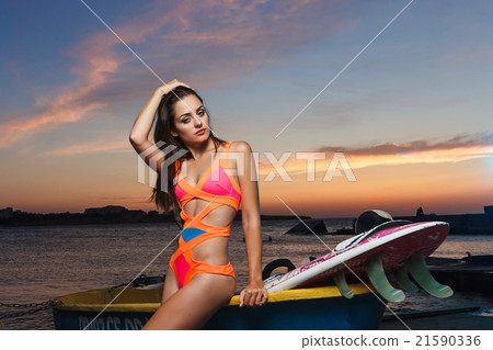 Fashion portrait: beautiful girl with surf board Fashion portrait: beautiful girl with surf board 21590336