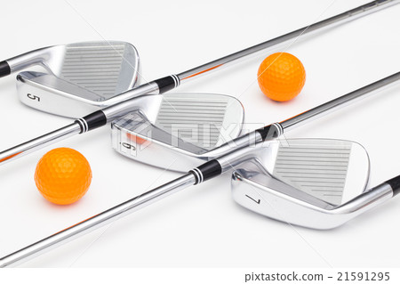 Titanium golf clubs on the white table Titanium golf clubs on the white table 21591295