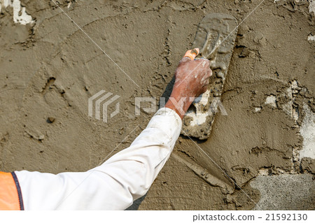 plasterer concrete worker at wall  21592130