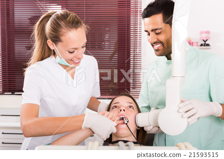 patient checking the teeth an digital xray patient checking the teeth an digital xray 21593515