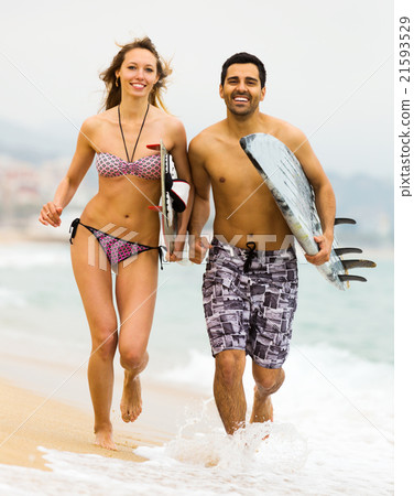 Happy family with surf boards 21593529