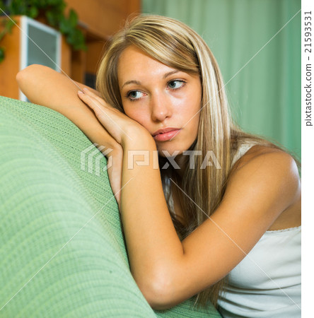 Blonde unhappy woman at home Blonde unhappy woman at home 21593531