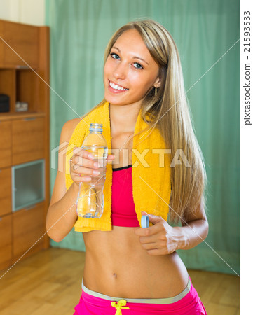 Girl with towel and bottle of water Girl with towel and bottle of water 21593533