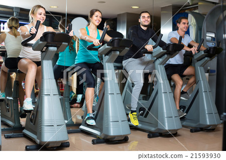 Group cycling in fitness club Group cycling in fitness club 21593930