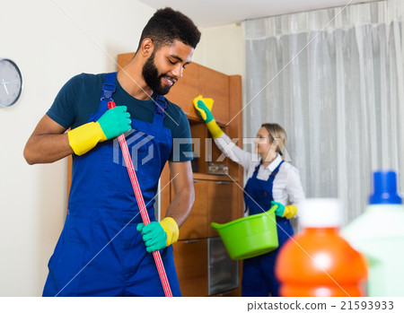 Black and white cleaners at the work. 21593933