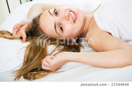 Girl lying in bed Girl lying in bed 21594648
