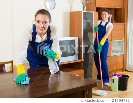 cleaners cleaning in room 21594781