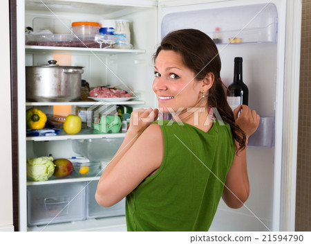 Woman looking in fridge 21594790
