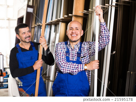 Two PVC industry workers in coveralls . 21595178