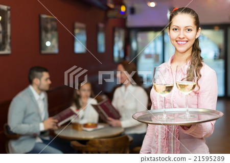 Waitress serving family of three 21595289