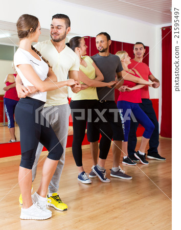 adults dancing bachata together i 21595497