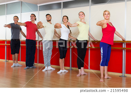 Group of men and women practicing at the ballet barre 21595498