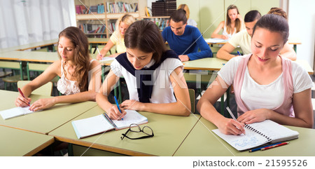 Students in classroom on exam Students in classroom on exam 21595526