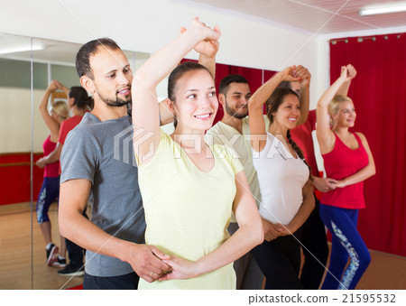 Group of people dancing salsa in studio Group of people dancing salsa in studio 21595532