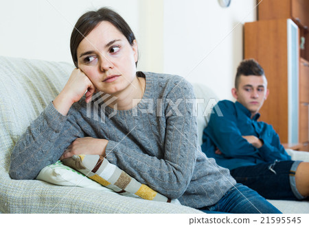 Frustrated mother scolding teenager son 21595545