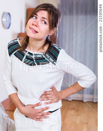 Woman feeling pain in the side Woman feeling pain in the side 21595649