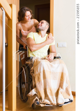 Worker brought person in wheelchair 21595855
