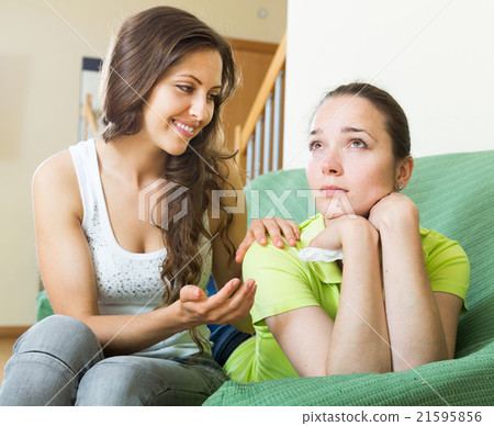 woman calms a crying friend 21595856