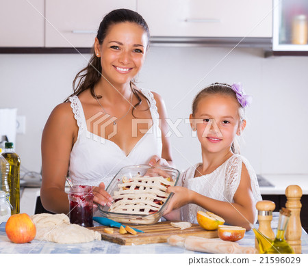 Woman and child cooking strudel 21596029