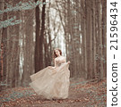 Beautiful girl in blooming spring garden 21596434