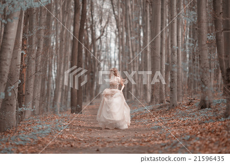 Beautiful girl in blooming spring garden 21596435