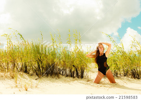 Beautiful sexy girl in swimwear on beach. 21598583