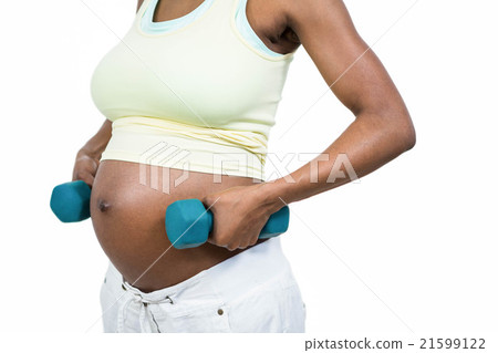 Pregnant woman lifting dumbbell 21599122