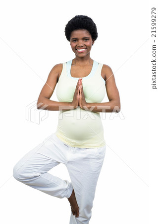 Pregnant woman doing yoga exercise 21599279