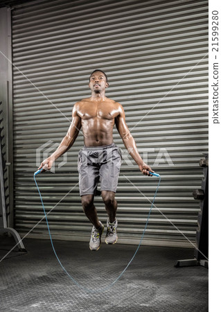 Shirtless man jumping the rope Shirtless man jumping the rope 21599280