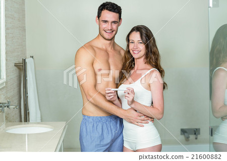 Portrait of happy couple embracing 21600882