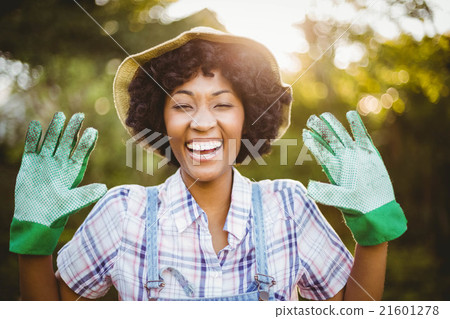 happy woman showing her gardening gloves happy woman showing her gardening gloves 21601278