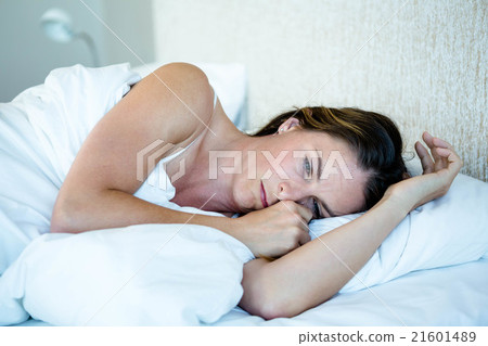 tired woman lying awake in her bed 21601489