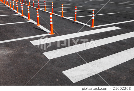 White traffic markings with a pedestrian crossing White traffic markings with a pedestrian crossing 21602268