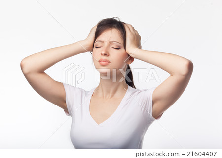 Headache concept - young woman suffering a 21604407