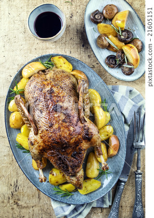 Roasted Duck with Potatoes, Apples and Quince on a 21605151