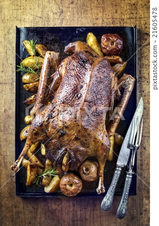 Roasted Goose with Potatoes, Apple and Quince Roasted Goose with Potatoes, Apple and Quince 21605478