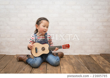 Girl playing guitar 21605785