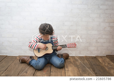 Girl playing guitar 21605786