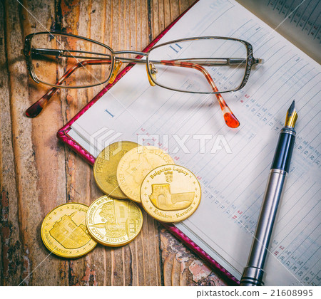 Coins and pen, business Coins and pen, business 21608995